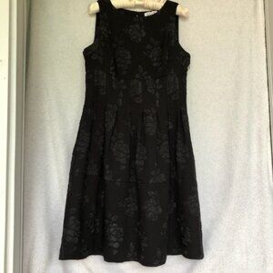 Elle black sleeveless cocktail dress with black rose appliques, size 8
